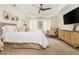 Comfortable main bedroom featuring tray ceiling, neutral tones, and sitting area at 2735 Jims Ne Rd, Marietta, GA 30066
