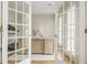 Home office featuring double doors, a large desk, and abundant natural light at 2735 Jims Ne Rd, Marietta, GA 30066
