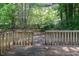 Wooden deck and fenced yard with foliage for privacy and shade at 5920 Hampton Ct, College Park, GA 30349