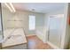 Bright bathroom with double sink vanity, tub and shower, and a window for natural light at 5920 Hampton Ct, College Park, GA 30349