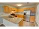 Bright kitchen featuring stainless steel appliances, granite countertops, and ample cabinet space at 5920 Hampton Ct, College Park, GA 30349