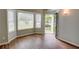 Bright living room with hardwood floors, large windows and view of the front yard at 5920 Hampton Ct, College Park, GA 30349