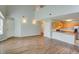 Open-concept living space with hardwood floors and seamless flow into the kitchen area with stainless steel appliances at 5920 Hampton Ct, College Park, GA 30349