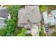 An aerial view of a house with a patterned roof and concrete driveway at 1267 Thomas Rd, Decatur, GA 30030
