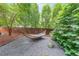 Relaxing backyard haven featuring a comfortable hammock, gravel area, and verdant foliage for ultimate tranquility at 1267 Thomas Rd, Decatur, GA 30030