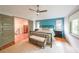 Bright bedroom featuring hardwood floors, neutral colors, and a cozy seating area at 1267 Thomas Rd, Decatur, GA 30030
