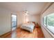 Cozy bedroom with hardwood floors, natural light and a modern bed frame at 1267 Thomas Rd, Decatur, GA 30030