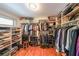 Custom walk-in closet with built-in shelving and ample hanging space for clothes and shoes at 1267 Thomas Rd, Decatur, GA 30030