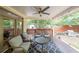 Charming covered patio with comfortable seating, ceiling fan, and outdoor grill, perfect for relaxation and entertaining at 1267 Thomas Rd, Decatur, GA 30030