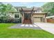 Striking home with stone accents, wood beams, and manicured landscaping, offering curb appeal and modern charm at 1267 Thomas Rd, Decatur, GA 30030
