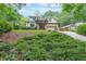 Stunning two-story home with lush greenery and a modern architectural design, blending nature with sophistication at 1267 Thomas Rd, Decatur, GA 30030