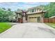 Modern two-story home featuring striking architectural details, attached garage and landscaped front yard at 1267 Thomas Rd, Decatur, GA 30030