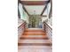 Inviting front porch with stone accents, wooden beams, and a stylish entrance, enhancing curb appeal at 1267 Thomas Rd, Decatur, GA 30030