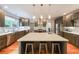 Modern kitchen with sleek cabinets, stainless steel appliances, and a spacious island perfect for culinary enthusiasts at 1267 Thomas Rd, Decatur, GA 30030