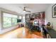 Home office with hardwood floors, natural light, a ceiling fan, and modern desk setup at 1267 Thomas Rd, Decatur, GA 30030