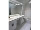 Bathroom showcasing double sink vanity with tub and shower in the background at 311 Indus Ln, Lawrenceville, GA 30044