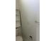 Powder room features a wall-mounted cabinet, a toilet, and a towel rack at 311 Indus Ln, Lawrenceville, GA 30044