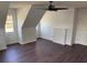 Bedroom features dark wood flooring, ample natural light, and vaulted ceiling at 311 Indus Ln, Lawrenceville, GA 30044