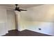 Bedroom has dark wood flooring, a ceiling fan and a bonus storage area at 311 Indus Ln, Lawrenceville, GA 30044