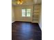 Bedroom with hardwood floors, a ceiling fan and a built-in bookshelf at 311 Indus Ln, Lawrenceville, GA 30044