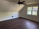 Bedroom with vaulted ceilings, ceiling fan, wood flooring and a window at 311 Indus Ln, Lawrenceville, GA 30044