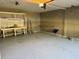 Spacious, clean garage with pegboard, shelving, and workbench at 311 Indus Ln, Lawrenceville, GA 30044