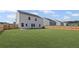 Spacious backyard with a privacy fence and a lush green lawn at 313 Foxglove Way, Mcdonough, GA 30253