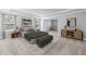 Spacious main bedroom featuring tray ceilings, a large rug, and natural light at 313 Foxglove Way, Mcdonough, GA 30253