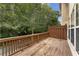 Inviting back deck with wood railing, perfect for outdoor relaxation at 3328 Chastain Gardens Nw Dr, Kennesaw, GA 30144