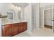 Bathroom featuring double sinks, modern lighting, and glass-enclosed shower stall at 3328 Chastain Gardens Nw Dr, Kennesaw, GA 30144