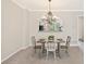 Cozy dining area features chandelier and open view to the kitchen at 3328 Chastain Gardens Nw Dr, Kennesaw, GA 30144