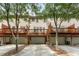 Back exterior shows multi-level deck and garage space under a multi-Gathering property at 3328 Chastain Gardens Nw Dr, Kennesaw, GA 30144