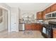 Charming kitchen features tile backsplash and stainless steel appliances at 3328 Chastain Gardens Nw Dr, Kennesaw, GA 30144