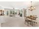 Open living area with fireplace, neutral walls, dining area, and plenty of natural light at 3328 Chastain Gardens Nw Dr, Kennesaw, GA 30144
