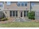 This backyard has a cozy patio, grass area, and lush greenery, perfect for relaxing or entertaining at 5016 Garrett Ct, Alpharetta, GA 30005