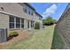 The backyard features a manicured lawn and a charming patio perfect for outdoor gatherings at 5016 Garrett Ct, Alpharetta, GA 30005