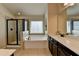 Bright bathroom featuring a soaking tub, shower, and dual sink vanity at 5016 Garrett Ct, Alpharetta, GA 30005