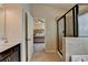 Bright bathroom featuring a glass enclosed shower and access to the bedroom at 5016 Garrett Ct, Alpharetta, GA 30005