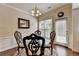 Dining area with decorative chairs, glass table and hardwood floors at 5016 Garrett Ct, Alpharetta, GA 30005