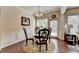 Elegant dining area with a glass table, decorative rug, and natural light perfect for Gathering gatherings at 5016 Garrett Ct, Alpharetta, GA 30005