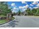 Welcoming gated entrance to a well-maintained community with beautiful landscaping and secure access for residents and visitors at 5016 Garrett Ct, Alpharetta, GA 30005