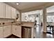Open kitchen featuring stainless steel appliances, granite countertops, and seamless flow to dining area at 5016 Garrett Ct, Alpharetta, GA 30005
