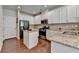 Well-equipped kitchen featuring stainless steel appliances, granite countertops, and ample cabinet space at 5016 Garrett Ct, Alpharetta, GA 30005