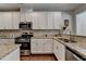 Beautiful kitchen with modern appliances, granite countertops, and ample natural light at 5016 Garrett Ct, Alpharetta, GA 30005