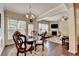 Open-concept living room with a fireplace, hardwood floors, and ample natural light at 5016 Garrett Ct, Alpharetta, GA 30005