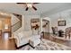 This home's living room features hardwood floors and an open floor plan at 5016 Garrett Ct, Alpharetta, GA 30005