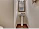 This is a close up of the powder room with hard wood floors at 5016 Garrett Ct, Alpharetta, GA 30005