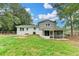 View of back of the house, showcasing the backyard with screened in porch at 1094 Amber Sw Rdg, Lilburn, GA 30047