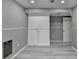 Finished basement area featuring cabinets, updated floors, and neutral paint colors throughout at 1094 Amber Sw Rdg, Lilburn, GA 30047