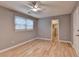 Bedroom featuring natural light, wood-look flooring, and a ceiling fan at 1094 Amber Sw Rdg, Lilburn, GA 30047
